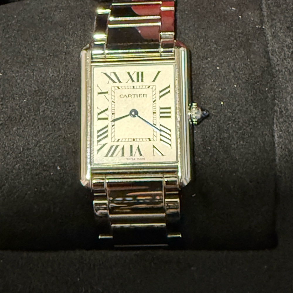 Tank must de Cartier stainless steel woman watch.